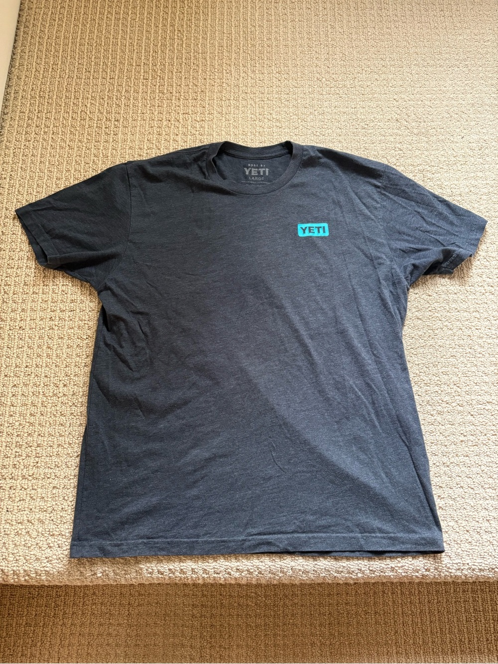 Yeti Men's Black Tee with Aqua Logo